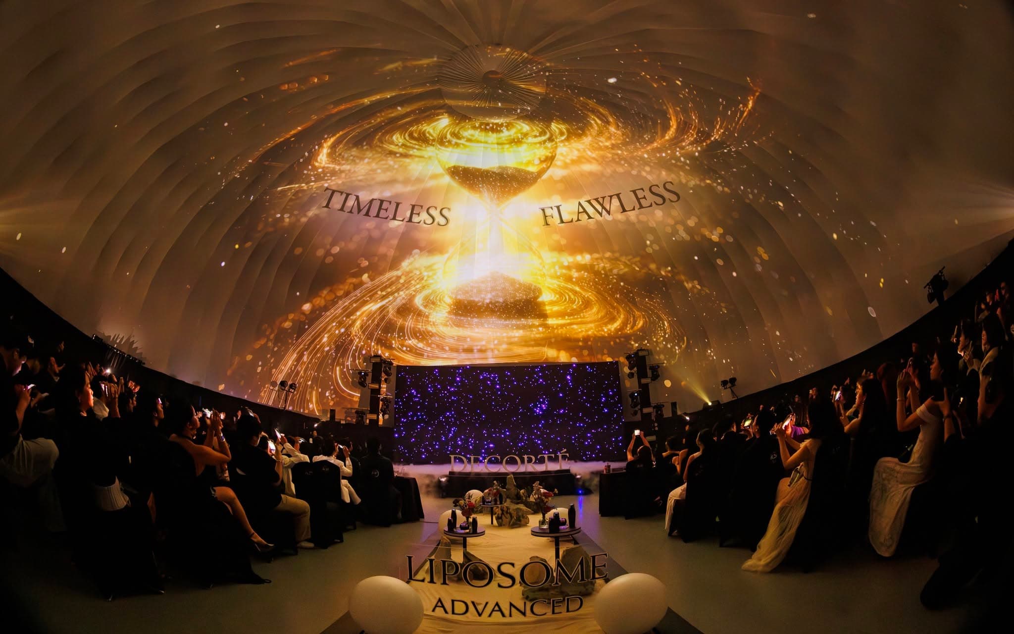 DECORTÉ luxury VIP lounge with refined floral scenography and ambient purple lighting