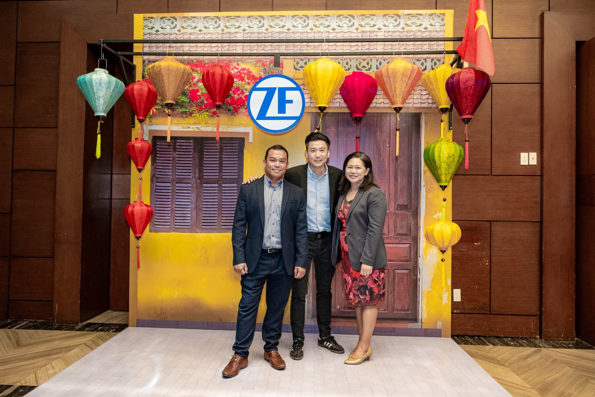 ZF Presentation Slide 05 - Partners and Hosts Framed by Hoi An Silk Lanterns